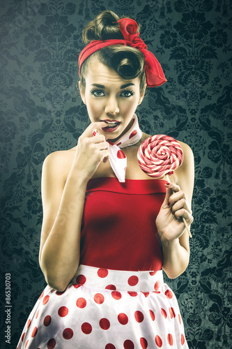 Naklejka - mata magnetyczna na lodówkę Pretty sexy woman in red vintage polka dot dress - with lollipop