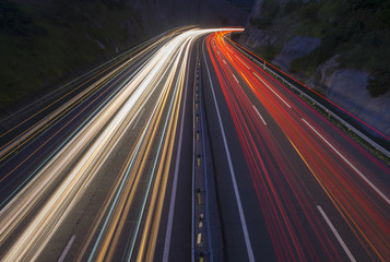 Wall Mural - Car lights at night on the road in the highway of Zarautz