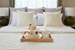 bedroom interior design with decorative tea set and dessert on b
