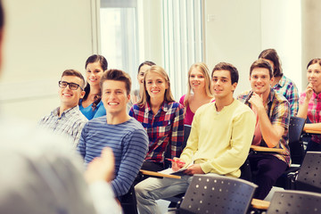 Poster - group of students and teacher with notebook