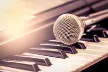 Classical Microphone On Keyboard In Vintage Color Tone