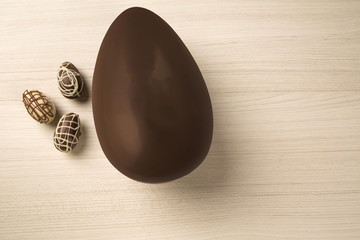 Wall Mural - Chocolate Easter Eggs Over Wooden Background