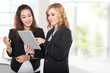 © Odua Images - two young businesswoman wtih tablet pc