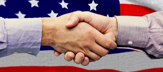 Poster - Composite image of hand shake in front of wires
