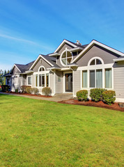 Luxury northwest home with large lawn.