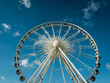 Brighton Wheel, UK, set against a blue sky.