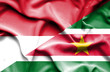 Waving flag of Suriname and Monaco