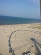 Ombra della ruota panoramica sulla spiaggia di Rimini