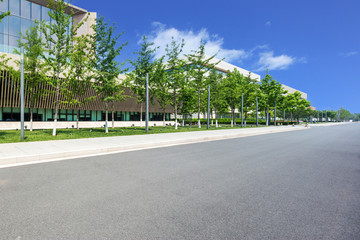 Wall Mural - modern building with empty road floor