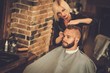 © Nejron Photo - Client visiting hairstylist in barber shop