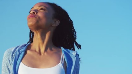 Wall Mural - Black woman smiling and laughing at the beach