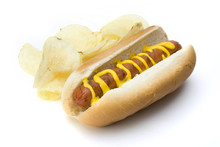 Hot Dog And Potato Chips – A Hot Dog In A Bun With Mustard. Potato Chips On The Side.