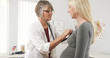 © rocketclips - Doctor listening to pregnant woman's heart