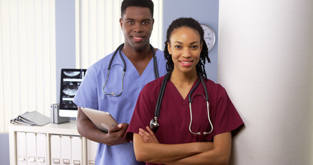 team of african american medical doctors standing together in hospital