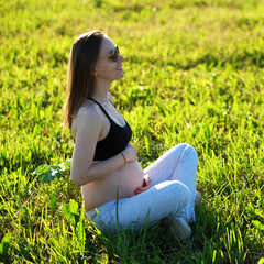 Wall Mural - Pregnant woman outdoors