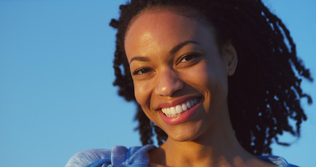 Wall Mural - Black woman smiling and laughing