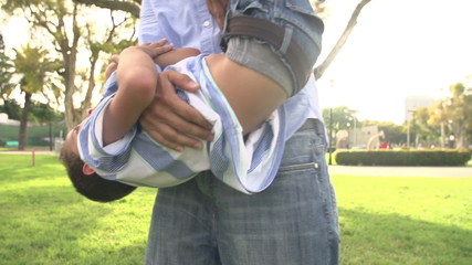 Wall Mural - Slow Motion Shot Of Father Playing With Son In Park