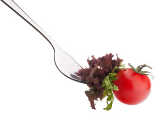 Fresh salad and cherry tomato on fork isolated on white backgrou