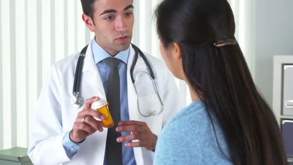 Wall Mural - Hispanic doctor explaining new prescription to patient