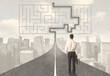© ra2 studio - Businessman looking at road with maze and solution