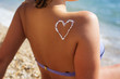 © _chupacabra_ - Closeup picture of sunscreen tan lotion on woman back