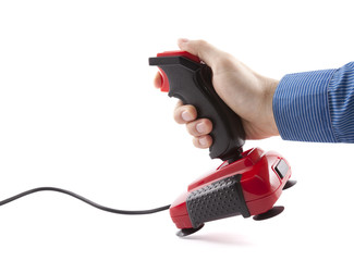 Wall Mural - Computer joystick with hand isolated on white. Clipping path included.