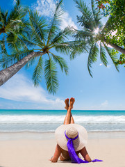 Canvas Print - Woman on a tropical beach at Maldives