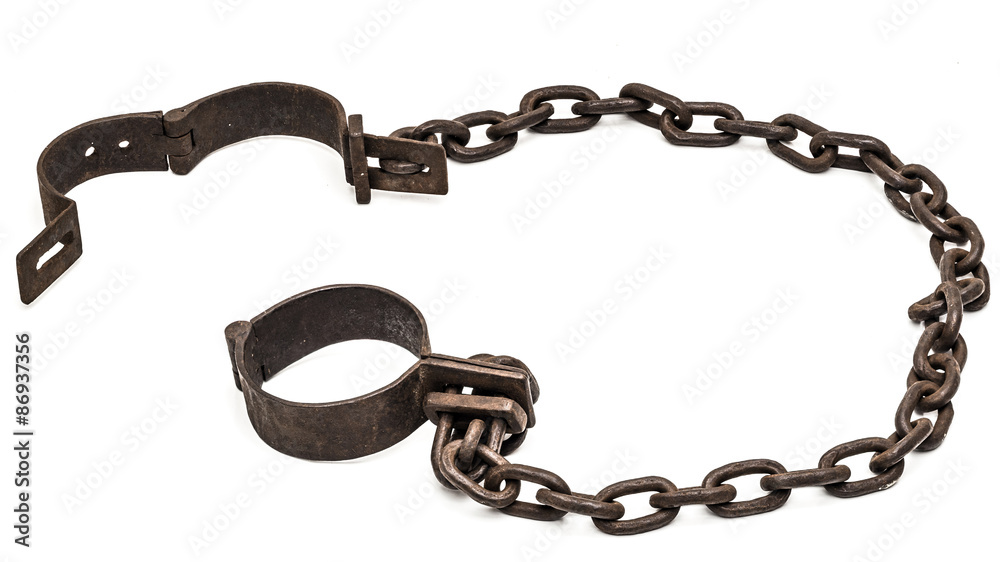 Old chains or shackles used for locking up prisoners or slaves between 1600 and 1800. - obrazy, fototapety, plakaty 