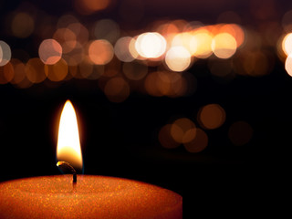 Christmas or festive glittery candle with bokeh background