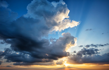 Wall Mural - dramatic sky with a setting sun