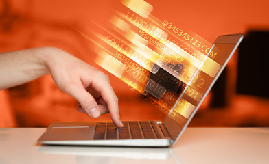 close up of man typing on laptop computer