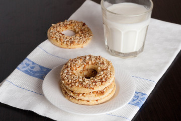 Ring shortbread cookies with nuts and glass of milk or yogurt, c