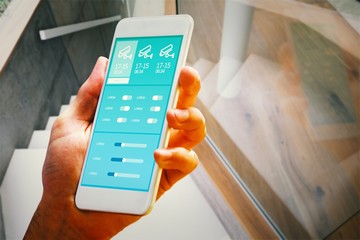 Poster - Composite image of hand holding smartphone