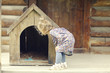 © kichigin19 - girl and small dog, dog house