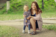 © kichigin19 - Mom and daughter in the park a young family