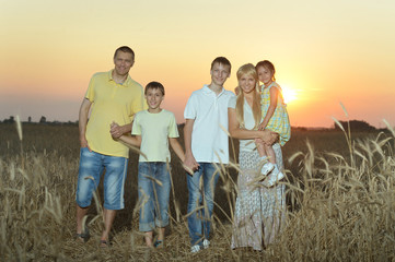 Wall Mural - Family having rest in field