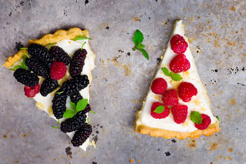 Wall Mural - slice of a tart with fresh berries.