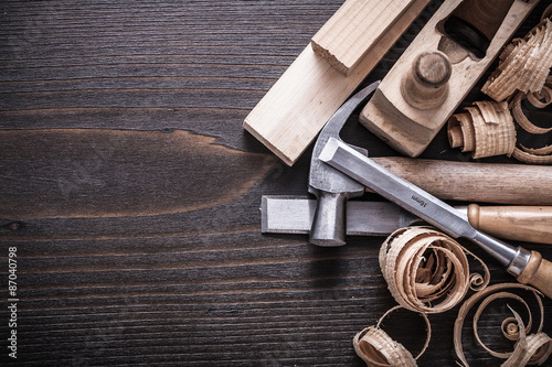Fotografia, Obraz Planer claw hammer firmer chisels wooden bricks and curled shavi