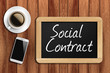 © underverse - coffee, phone  and chalkboard with  word social contract
