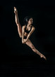 © jutaphoto - young ballet dancer dansing on black background