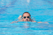 © astrosystem - Sportsman swimming in a pool.