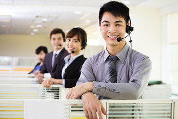 young business team working with headset in office