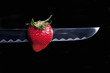 Strawberry
Strawberry pierced by a katana with a black background