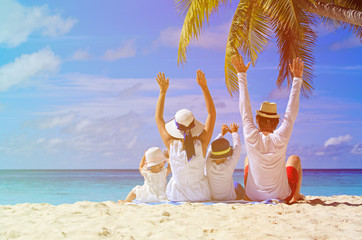 happy family with two kids on the beach