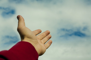 hand pointing to the sky