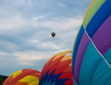 Three Hot Air Balloons Line Up While Being Inflated With Hot Air Getting Ready To Launch At Festival