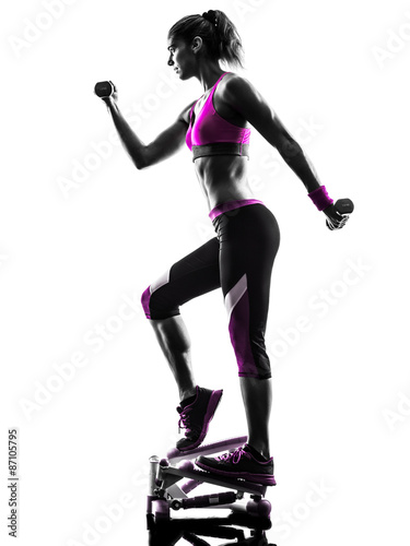 Fototapeta na wymiar woman fitness stepper weights exercises silhouette