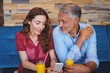 © WavebreakMediaMicro - Cute couple sitting in cafe