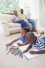 Wall Mural - Happy siblings on the floor drawing