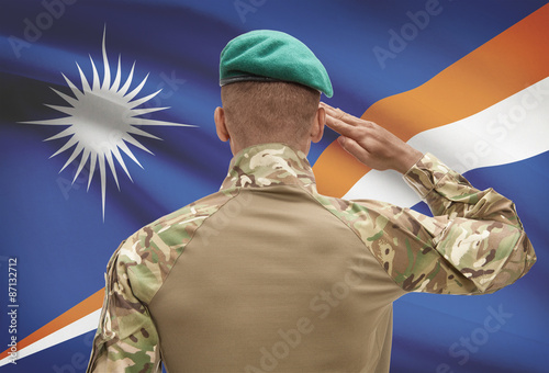 Fotografía Dark-skinned soldier with flag on background - Marshall Islands